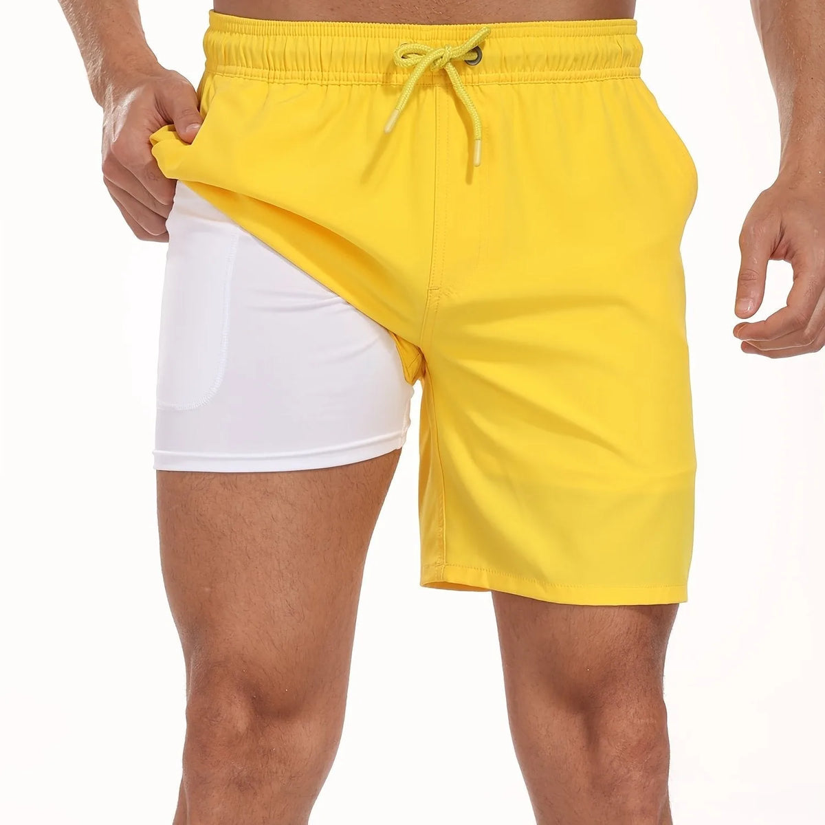 Close-up of white drawstring waistband detail on navy swim shorts with toggle fastening