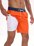Close-up detail of orange swim shorts with navy waistband and white drawcord, showing inner pocket construction