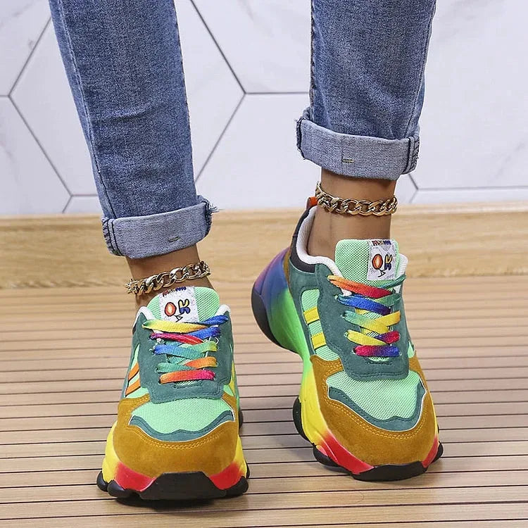 Back view of green and mustard chunky sneakers highlighting the rainbow gradient outsole and heel cushioning