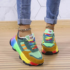 Front view of green and mustard chunky sneakers showing mesh panels and tonal lace detailing