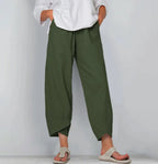 Front view of olive green linen-blend pants showing the elastic waist and tapered tulip-style hem
