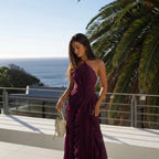 Detail shot of the thin halter neck strap and pleated fabric at the shoulder