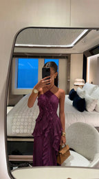 Full body shot of the pleated maxi dress showing the fitted bodice and flowing skirt silhouette