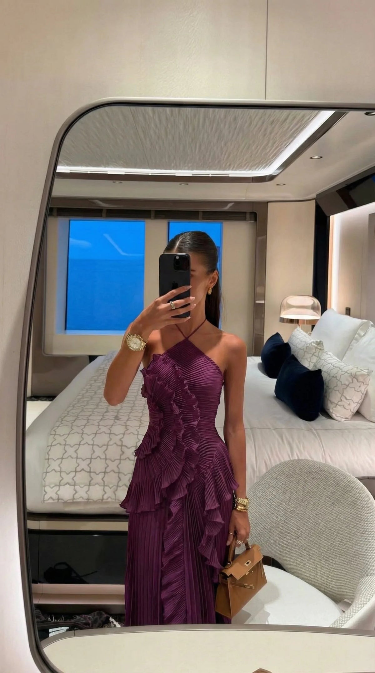 Full body shot of the pleated maxi dress showing the fitted bodice and flowing skirt silhouette