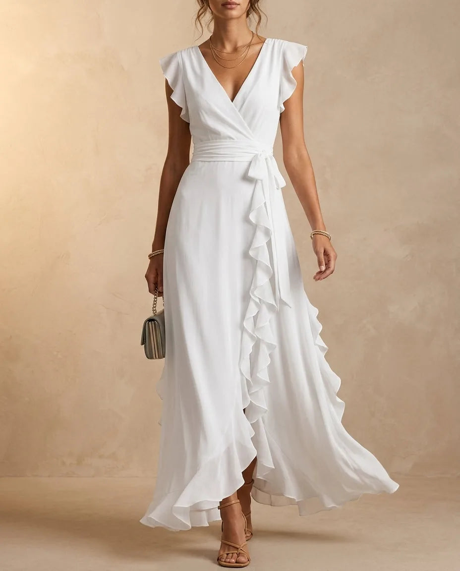 White ruffle wrap-style maxi dress with tie waist and cascading skirt ruffle, floor length hem