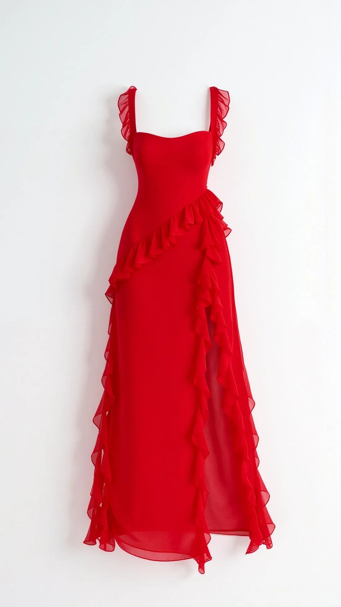 Woman in black ruffled maxi dress posing with hand on hip, showing the fitted waist and flowing ruffle skirt