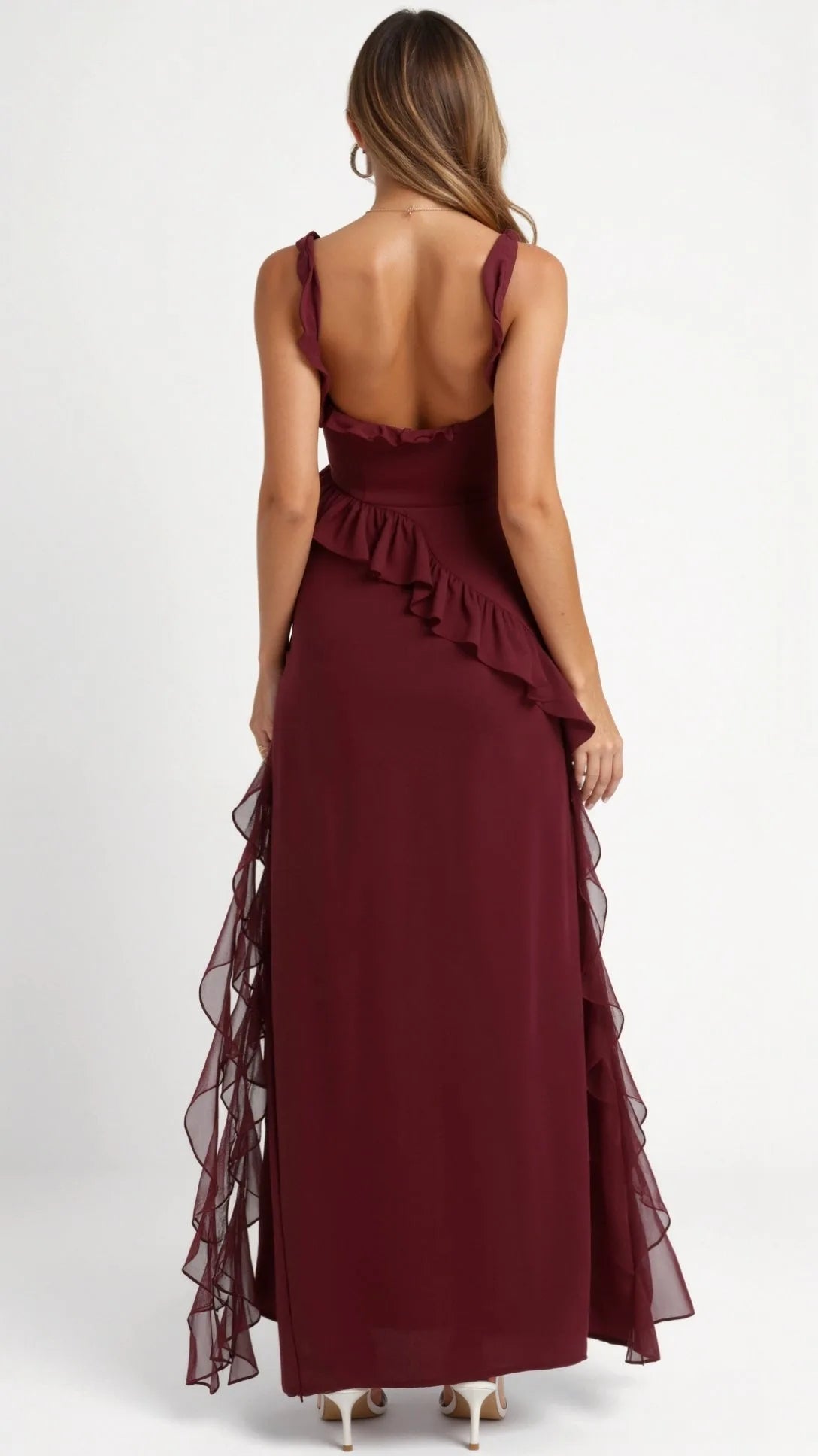 Woman in dark brown ruffled maxi dress smiling, front view showing the fitted bodice and ruffle shoulder straps