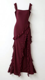 Close-up of dark brown ruffled maxi dress neckline and ruffle strap detail against tanned skin
