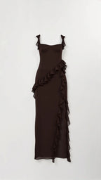 Dark brown ruffled maxi dress shown flat on a hanger, highlighting the diagonal ruffle overlay and tie straps