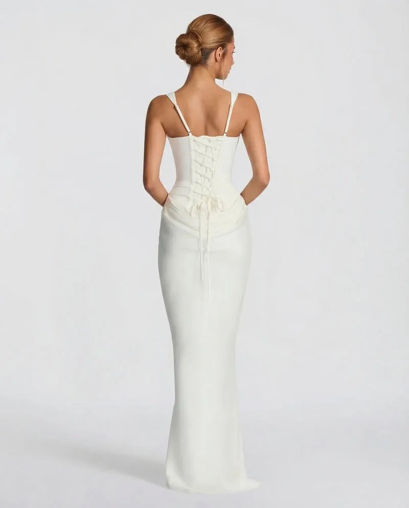 Full-length front view of a model wearing the black satin corset dress with a soft skirt flare at the hem