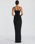 Full-length front view of a model wearing the black satin corset maxi dress with square neckline