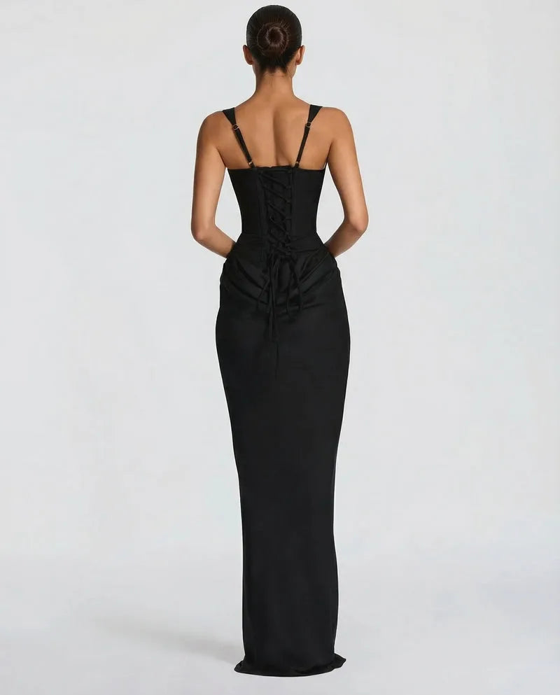 Full-length front view of a model wearing the black satin corset maxi dress with square neckline