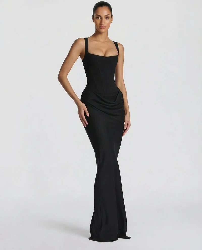 Front view of the black corset maxi dress showing the draped waist and sleek floor-length skirt