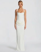 Side view of the black satin dress highlighting the structured boned bodice and fluid skirt drape