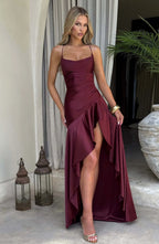 Front view of the dress in soft blush pink satin, showing the cowl neck and high-low ruffled skirt