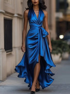Royal blue satin halterneck maxi dress with wrap bodice, bow waist tie and dramatic ruffled high-low skirt