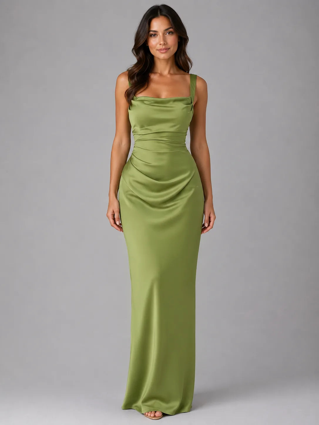 Front view of model wearing an olive green satin maxi dress with square neckline, ruched waist and shoulder straps