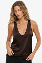 Close-up front view of the brown satin tank top highlighting the scoop neckline and smooth satin texture