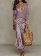 Lilac satin slip maxi dress paired with a matching lavender V-neck jumper, close-up front view