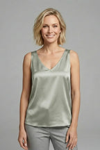Back view of a dark green satin singlet showing the V-shaped back neckline and straps