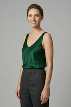 Woman wearing a champagne satin singlet, front view highlighting the relaxed straight silhouette