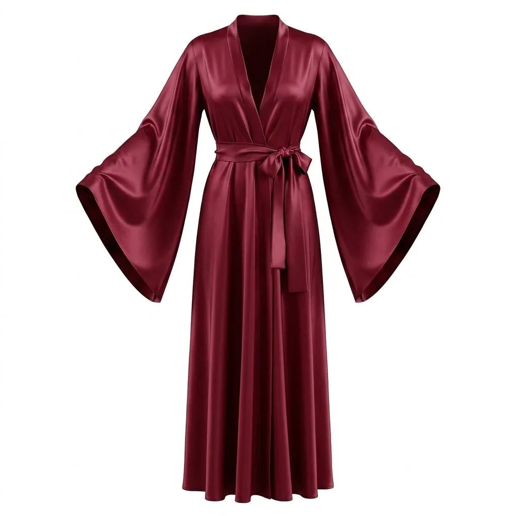 Woman in red satin robe standing against a plain wall, showing the overall silhouette