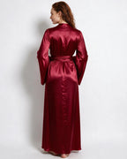 Woman in red satin robe with arms relaxed, showing the drape of the wide sleeves from the front