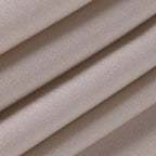 Flat lay close-up of the adjustable spaghetti strap and slider on the beige satin dress