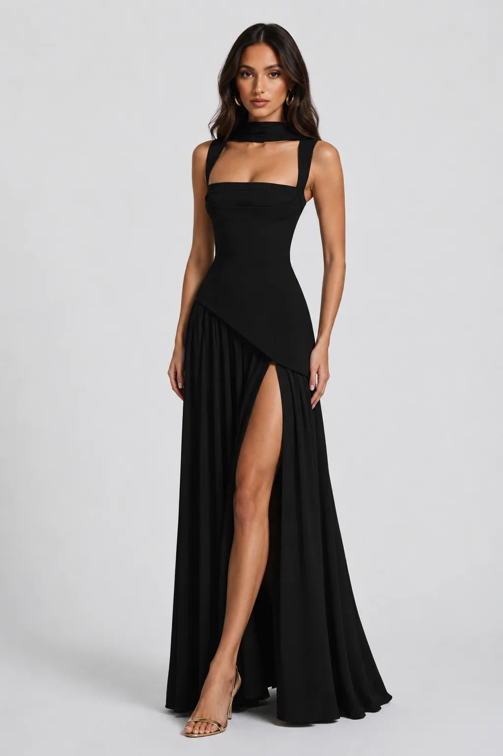 Full-length front view of the burgundy maxi gown paired with nude strappy heels