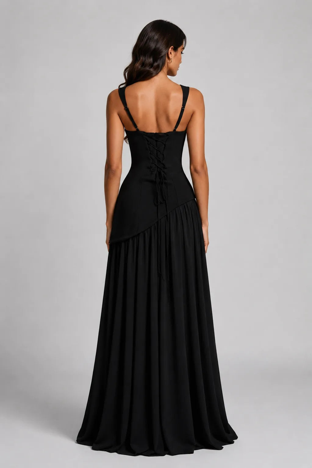 Front view of the burgundy dress skirt detail showing the asymmetric draped gather and high slit