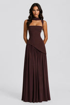 Close front view highlighting the sculpted bustier bodice and asymmetric gathered skirt in brown