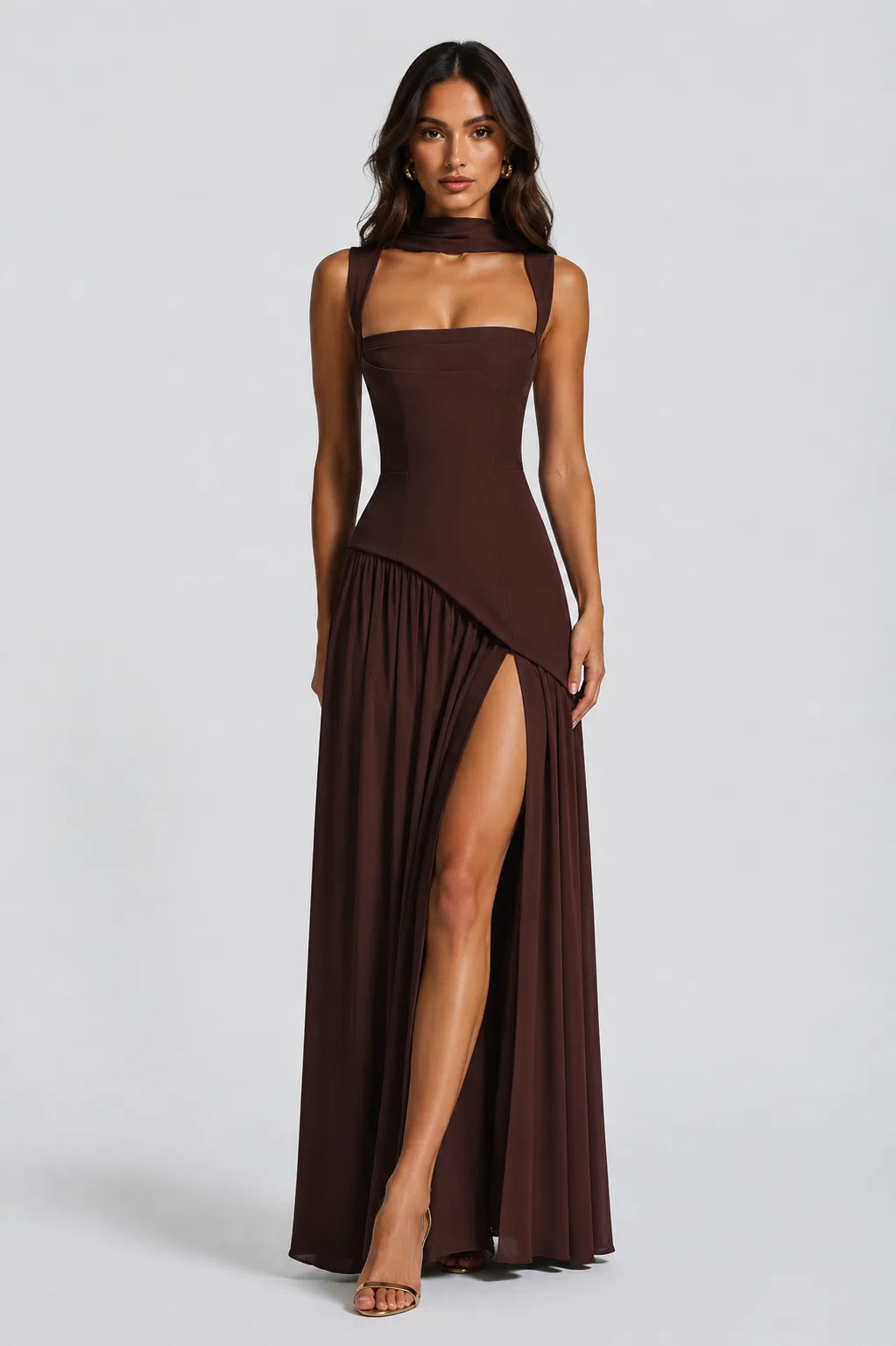 Full-length front view of the brown maxi dress styled with strappy heels on a plain background