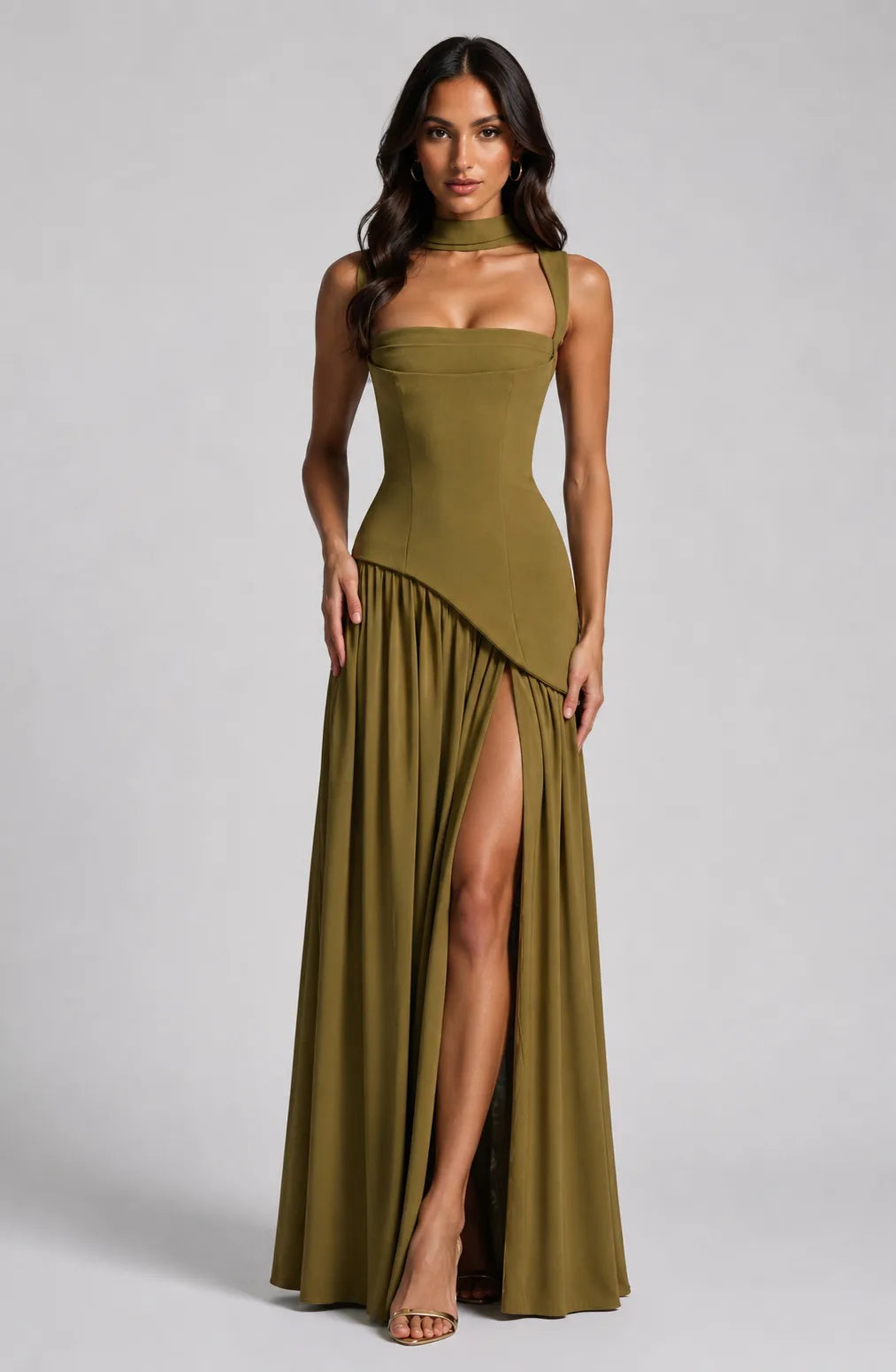 Front view of the brown gown with hands clasped behind the back, showing the fitted waist seam