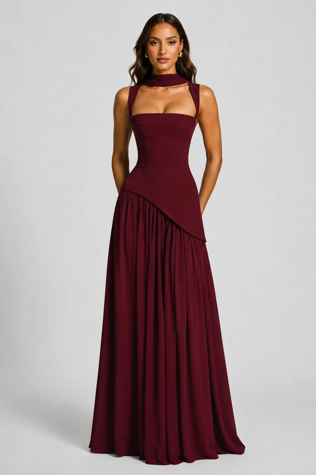 Front view of the olive green maxi dress with the scarf tail held out to show its flowing drape