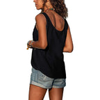 Side angle of the grey sleeveless top paired with a tan leather belt and cuffed denim shorts