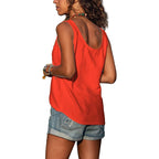 Back view of the orange-red singlet top highlighting the soft cotton-blend drape and curved hem