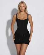 Front view of black square-neck corset mini dress with ribbed bodice and sparkle textured skirt