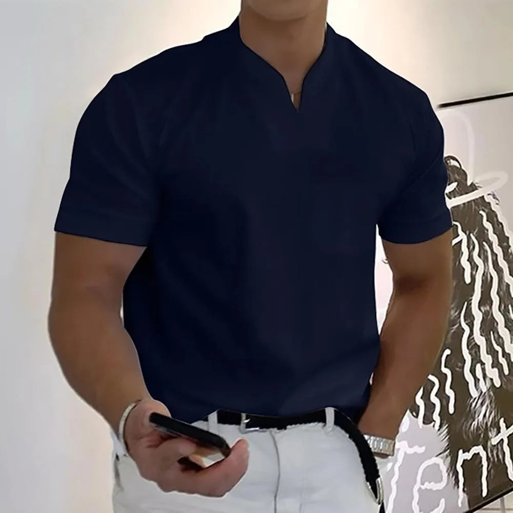 Navy split-neck short sleeve polo shirt with a chest pocket, shown on a model holding a phone