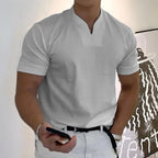 Light grey split-neck short sleeve polo shirt with a chest pocket, front view on model