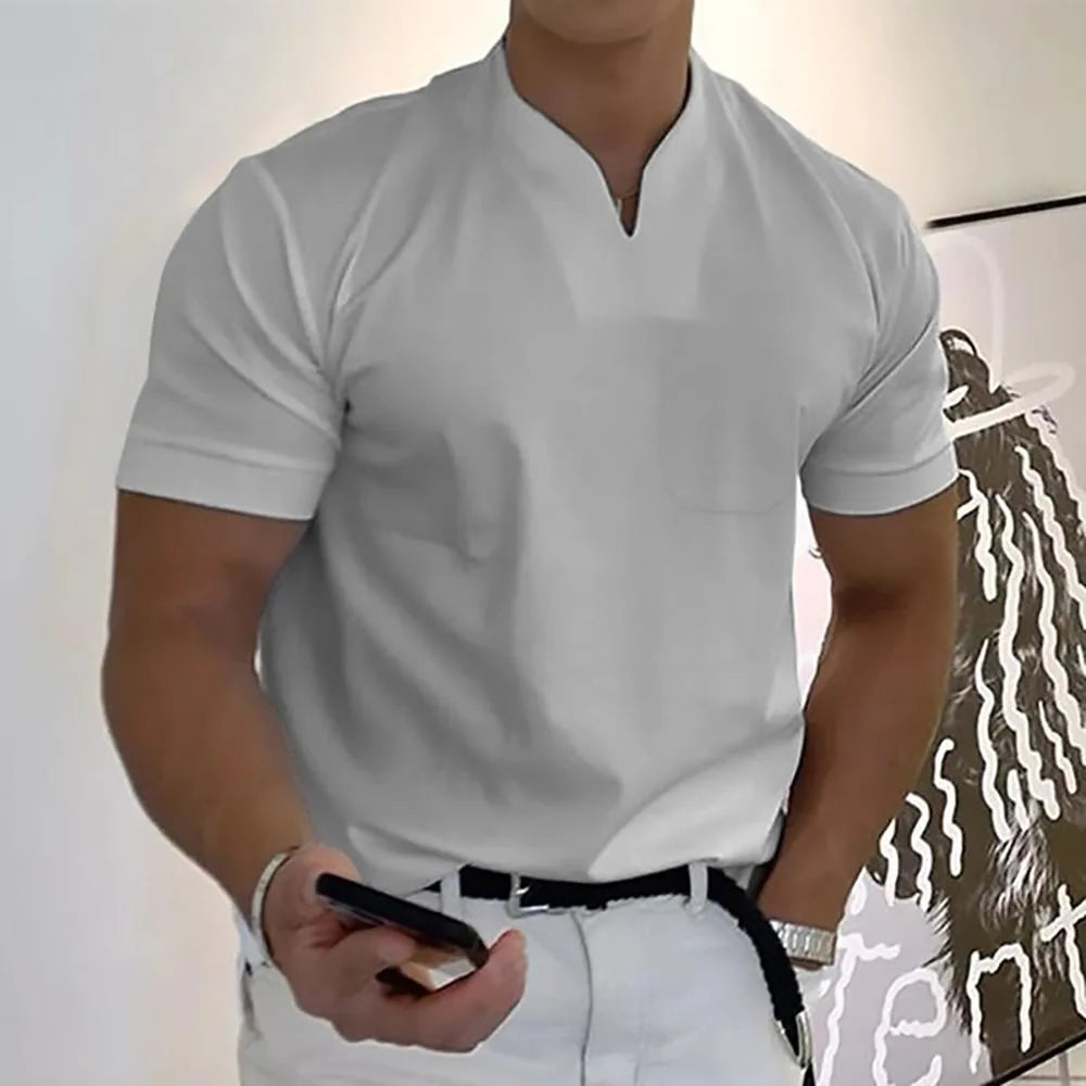 Light grey split-neck short sleeve polo shirt with a chest pocket, front view on model