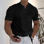 Black split-neck polo tee with short sleeves and a chest pocket, paired with a black belt