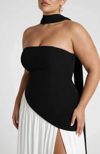 Close-up of black strapless bodice with draped choker neckband and asymmetric waist seam
