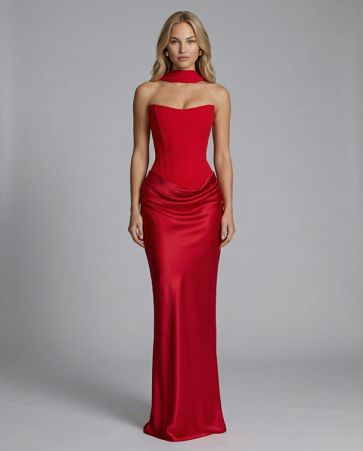 Side angle view of the black corset gown showing the sculpted waistline and flowing satin skirt