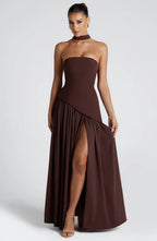 Full-length front view of brown strapless gown with neck scarf detail and gathered asymmetrical hemline