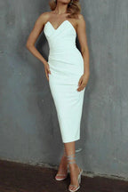 Close crop of the sweetheart neckline and draped bodice folds on the strapless midi dress