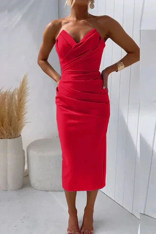 Strapless red midi dress with draped sweetheart bodice and ruched panel along the hip
