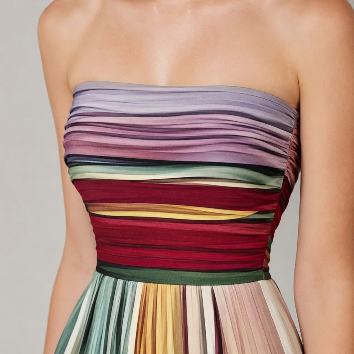 Close-up of the ruched strapless bodice showing the fine pleating and rich multicolour stripe pattern in burgundy, green, gold and lilac