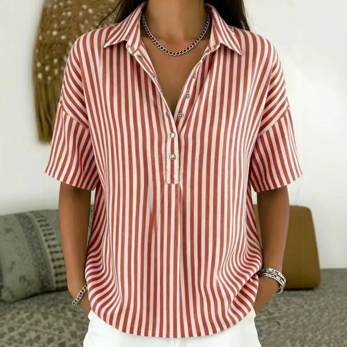Rust red and white striped collared blouse with relaxed short sleeves and open top button