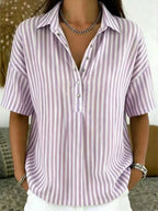 Soft lilac and white striped blouse with classic collar and half-placket buttons, paired with layered necklace