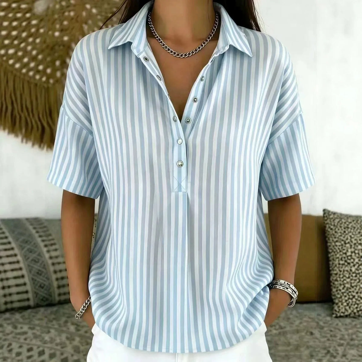 Pale blue and white vertical striped collared blouse with relaxed fit and short sleeves